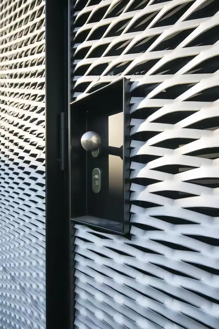 Expanded metal screen panel detail showing raised openings for facade applications