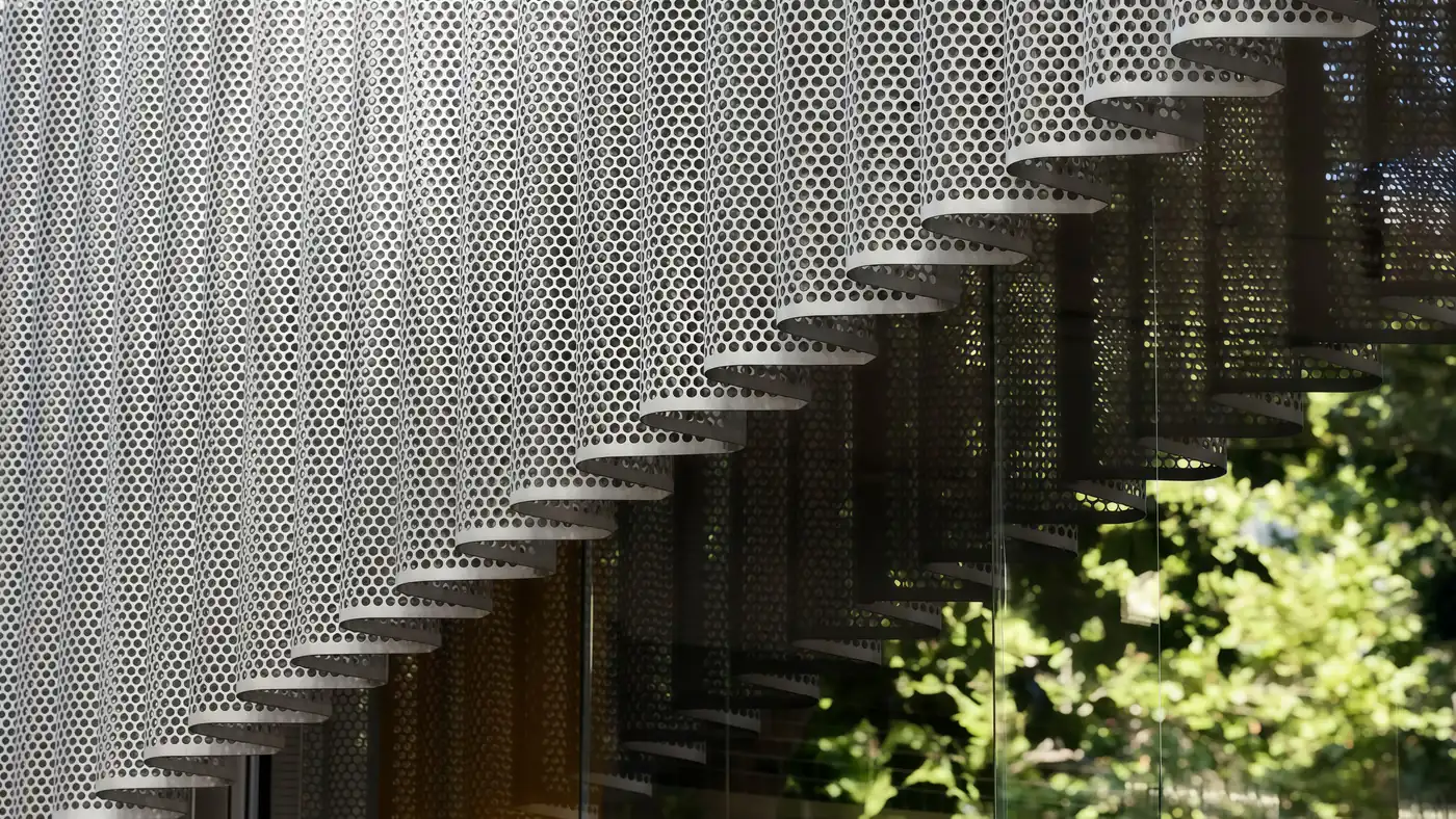 SGORIA custom perforated metal mesh feature surface for architectural projects