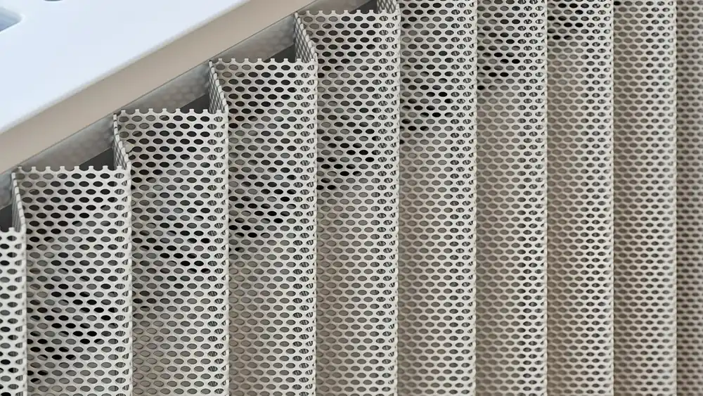 Perforated metal screen panel with round holes used for architectural screening