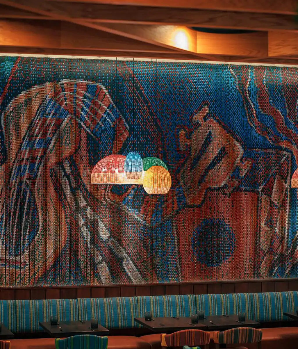 Custom graphic chain curtain wall in a restaurant interior