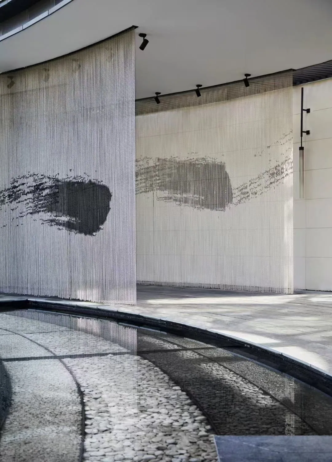 Custom chain curtain graphic used near a water feature