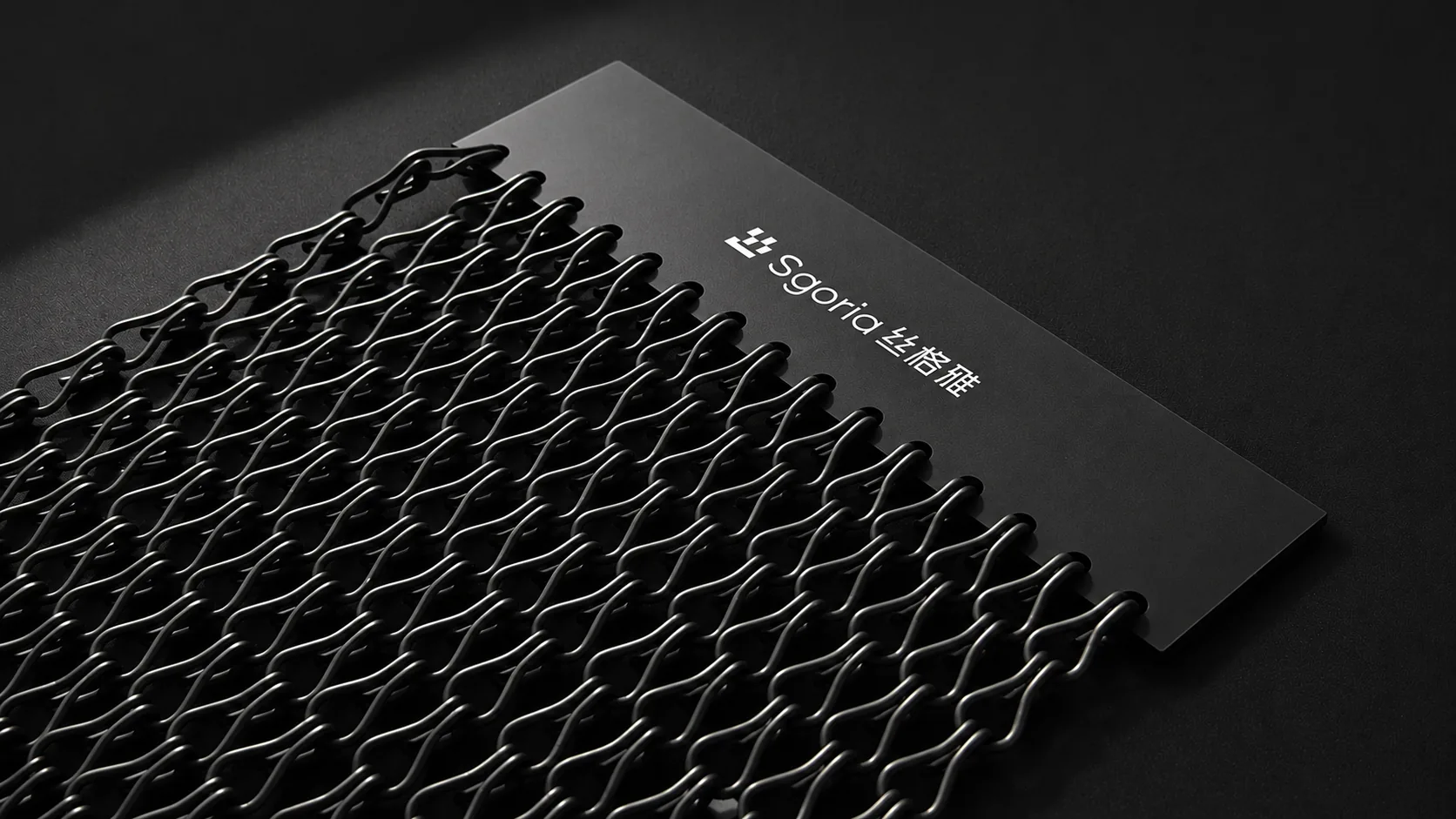 SGORIA black architectural metal mesh sample and brand card