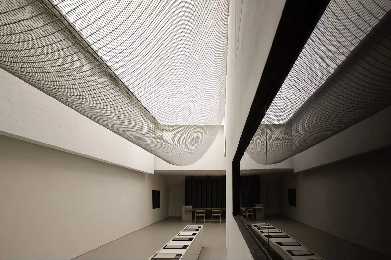 Cable rod wire mesh used as a soft ceiling wave feature