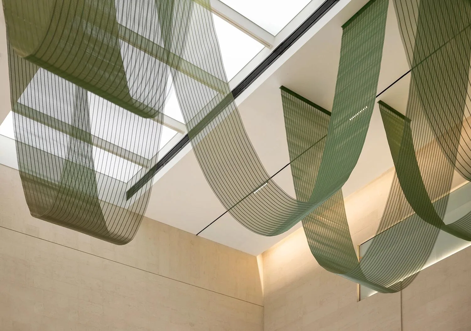 Green cable rod mesh arranged as a draped ceiling feature