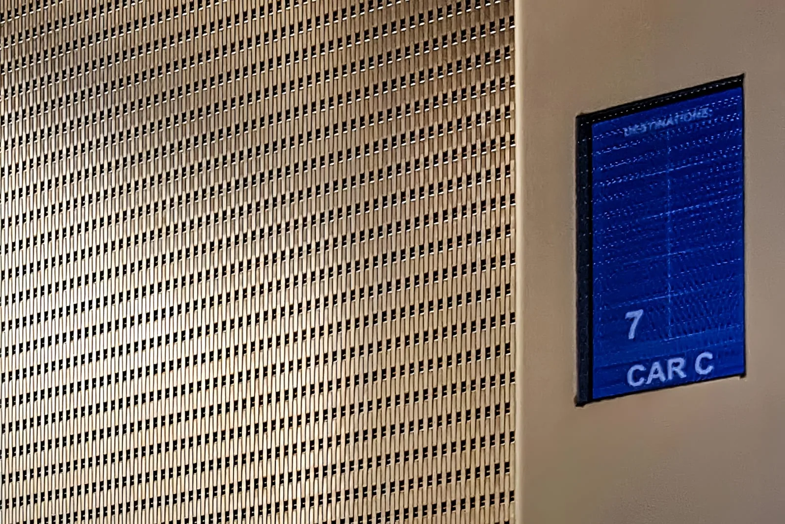 Decorative metal sheet panel detail for elevator cab installation