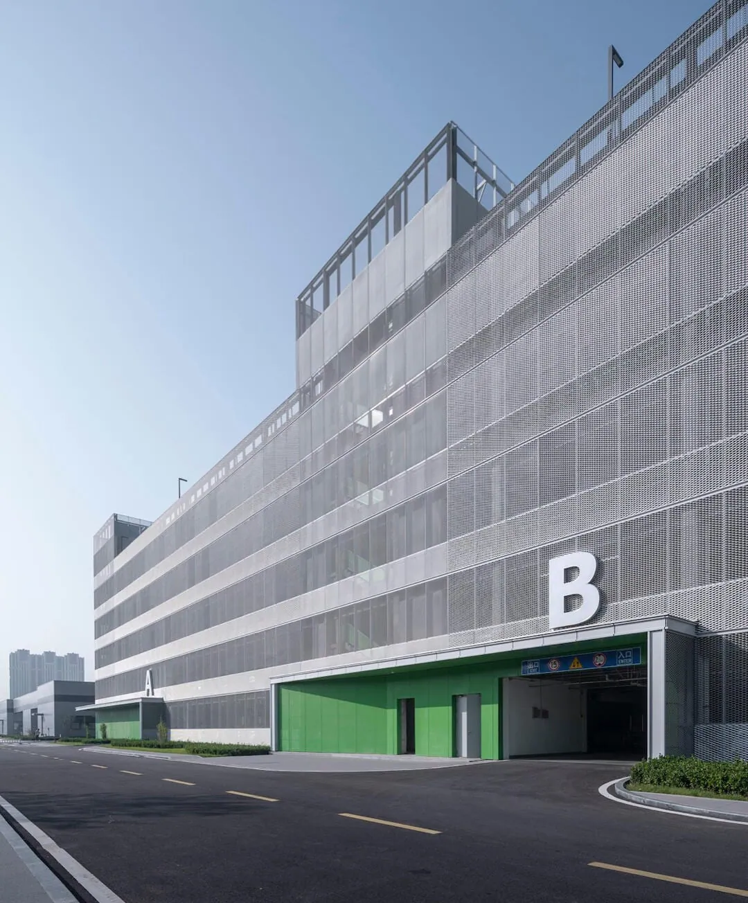 Expanded metal parking garage ventilation screen installed on a building facade