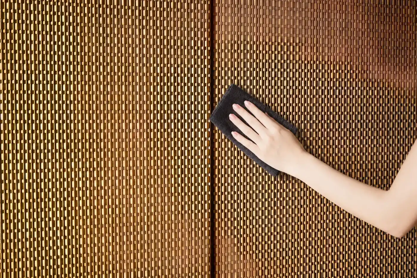 Architectural metal mesh surface being cleaned for long-term care